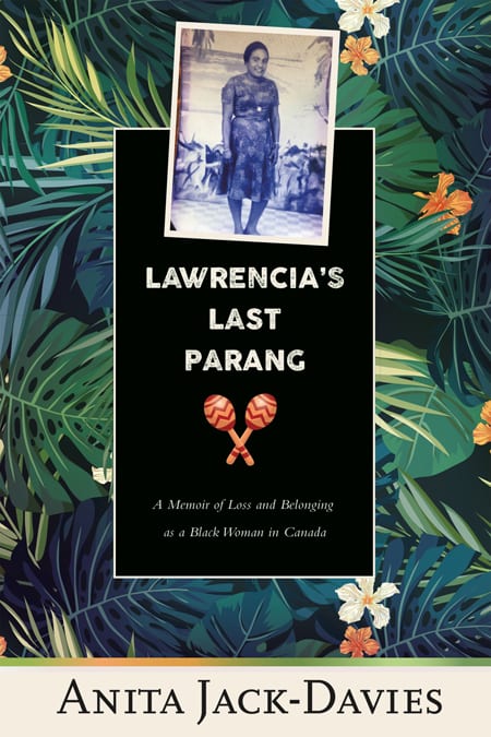 book cover on background of large green tangled tropical leaves and small white and orange flowers. a vintage photo of an older Black woman wearing a pretty blue floral dress is framed at the top of the cover with a black vertical rectangular frame featuring white typography: "Lawrencia's Last Parang" and scripted text: "A Memoir of Loss and Belonging as a Black Woman in Canada." A pair of orange-brown chac-chac are centred in the middle. "Anita Jack-Davies" appears at the bottom of the cover,